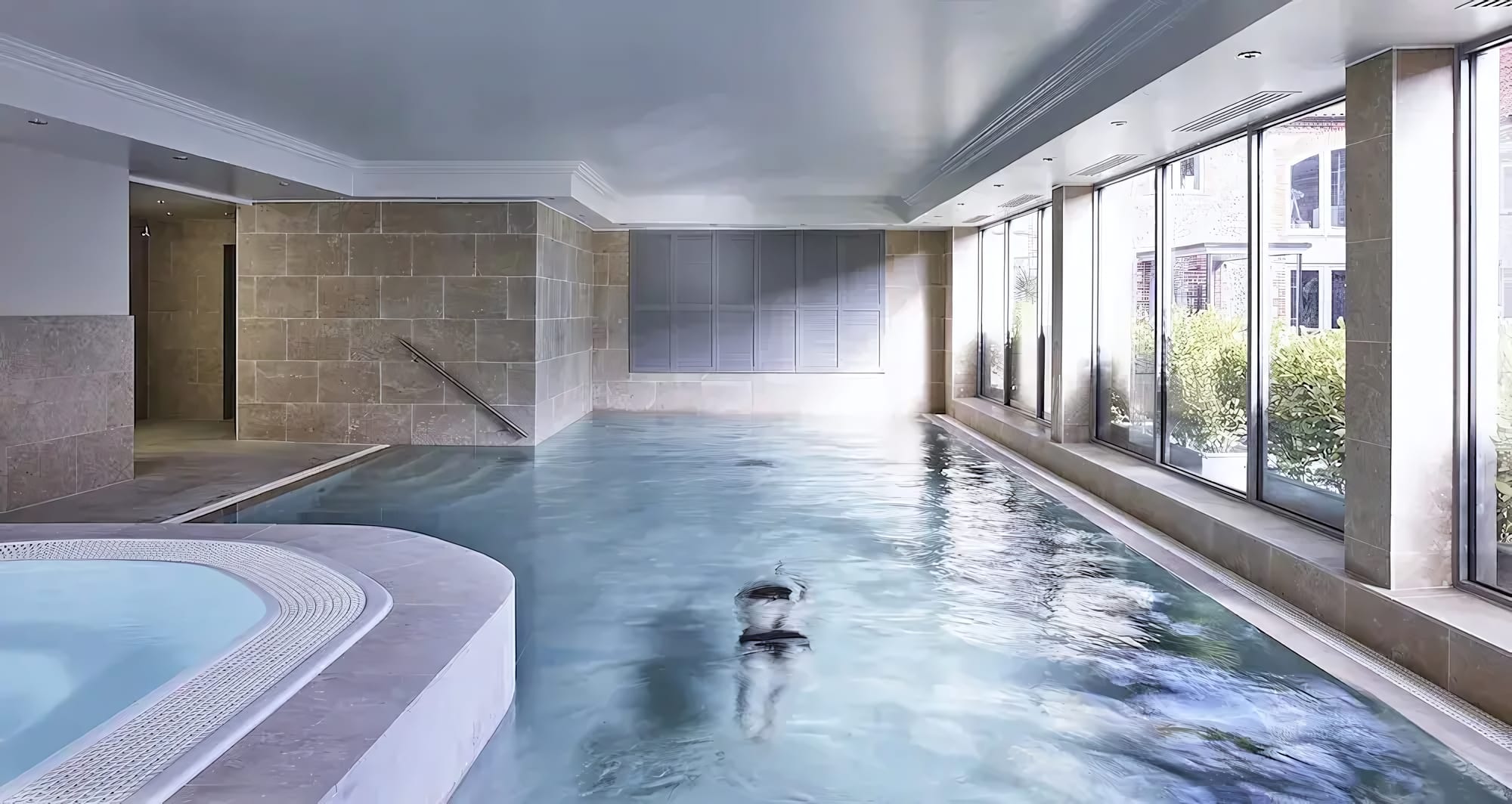 A Stone-Clad Pool Bathed in Natural Light